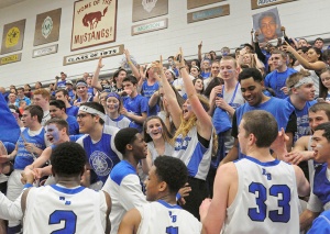 Exuberant Riverside Brookfield fans greet the team after the Bulldogs win their 4A sectional final 66-61 over Morton in Cicero. Photo by Bill Ackerman